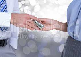 Hands exchanging money business with sparkling light bokeh background