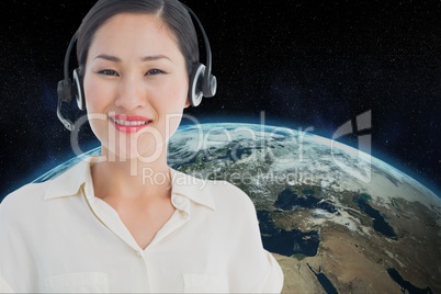 A model wearing a headphone against earth background