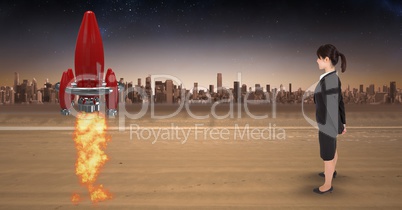 Digitally generated image of businesswoman looking at rocket launch while standing against city