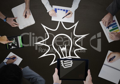 Overhead of business team with blackboard and white lightbulb graphic
