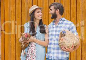 couple in the farm with yellow wood background