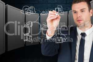 Businessman drawing ion the screen against server room background