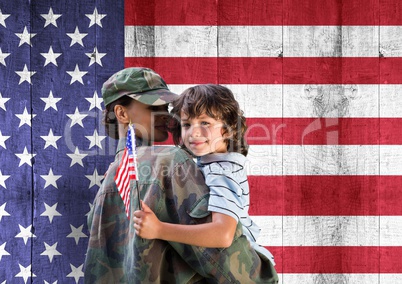 soldier and son in front of usa flag