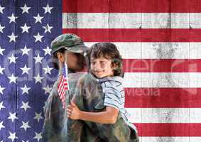 soldier and son in front of usa flag