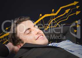 Business man lying back against yellow graph doodle and grey background