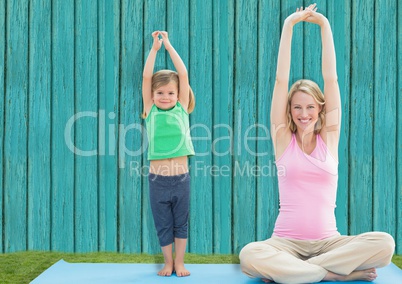 fitness mum and daughter  with light blue wood background
