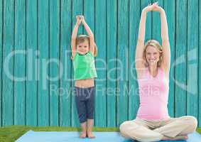 fitness mum and daughter  with light blue wood background