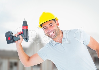 Carpenter  with drill on building site