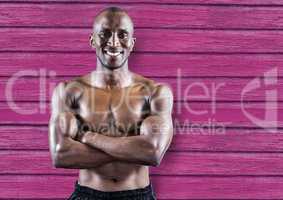 fitness man hands folded with pink wood background