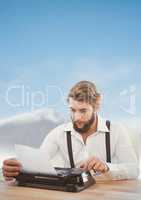 Hipster man  on typewriter with sky