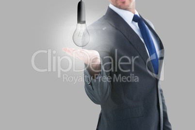 Light bulb in businessman hands