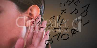 Composite image of close up of businesswoman trying to listen