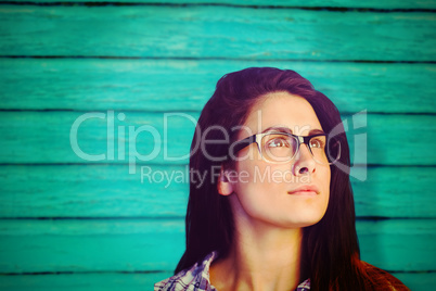 Composite image of close up of thoughtful woman wearing eyeglasses