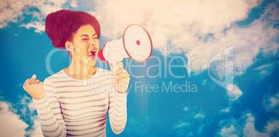 Composite image of excited woman shouting with megaphone