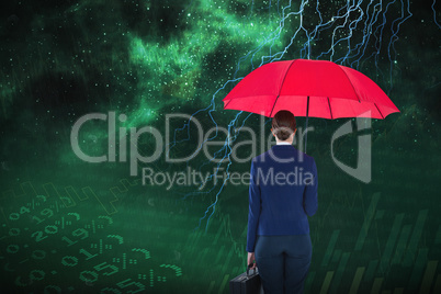 Composite image of full length rear view of businesswoman carrying red umbrella and briefcase