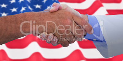 Composite image of business people shaking hands on white background