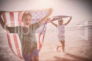 Happy children taking an american flag