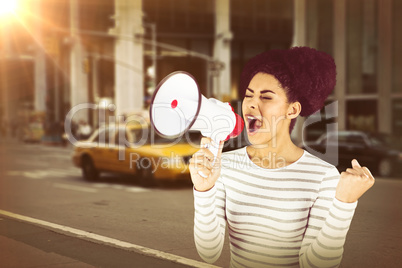 Composite image of excited woman shouting with megaphone