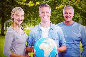 Composite image of portrait of people with globe