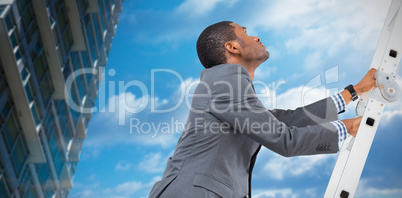 Composite image of businessman climbing up ladder