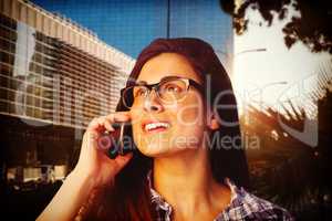Composite image of close up of young woman talking on phone