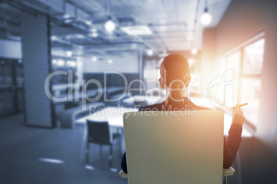 Composite image of rear view of confident businesswoman holding cigar