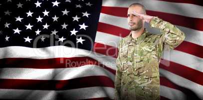 Composite image of soldier giving salute