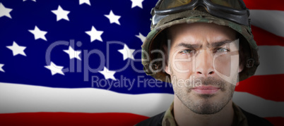 Composite image of close up of unsmiling soldier