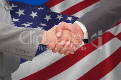 Composite image of handshake between two business people