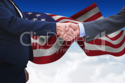 Composite image of entrepreneurs shaking hands