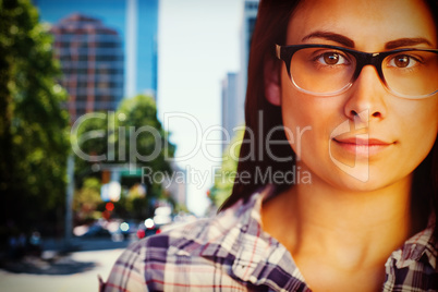 Composite image of close up portrait of young woman wearing eyeglasses