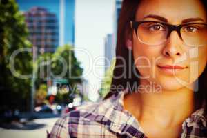 Composite image of close up portrait of young woman wearing eyeglasses
