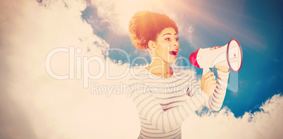 Composite image of young woman using megaphone for making announcement