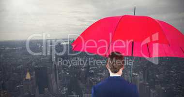 Composite image of full length rear view of businesswoman carrying red umbrella and briefcase