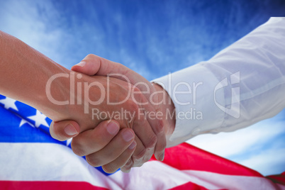 Composite image of man and woman doing formal handshake