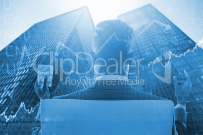 Composite image of rear view of businessman holding whisky glass and cigar