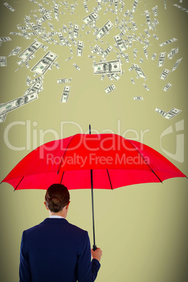 Composite image of rear view of businesswoman holding red umbrella