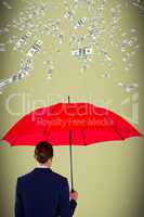 Composite image of rear view of businesswoman holding red umbrella