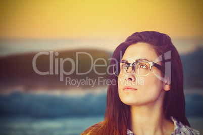 Composite image of close up of thoughtful woman wearing eyeglasses