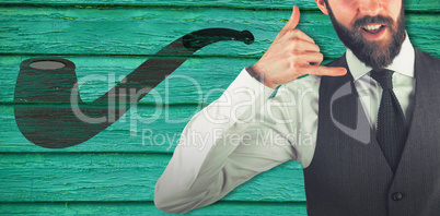 Composite image of portrait of businessman gesturing shaka sign