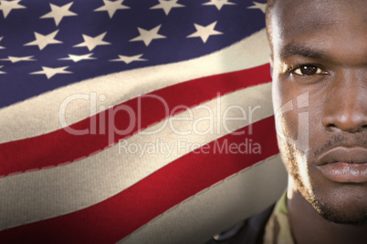 Composite image of close up portrait of confident soldier