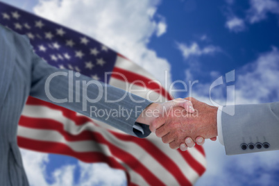 Composite image of male and female entrepreneurs shaking hands
