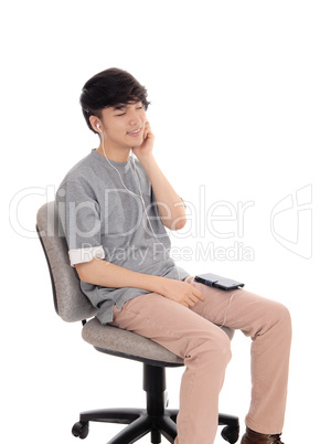 Asian man enjoying the music. Asian man enjoying the music.