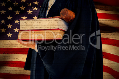 Composite image of lawyer holding scales of justice