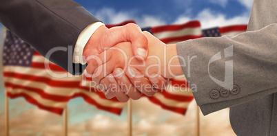 Composite image of handshake between two business people