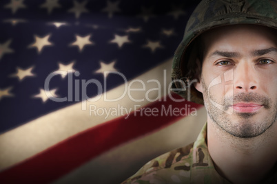 Composite image of close up of confident soldier wearing hard hat