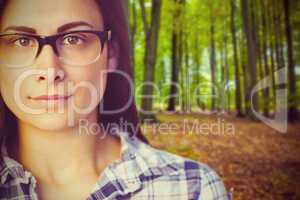 Composite image of close up portrait of young woman wearing eyeglasses