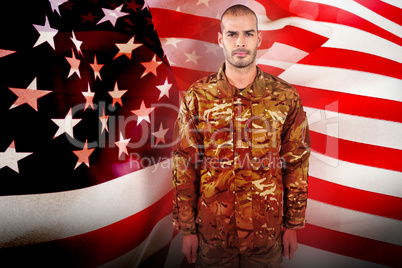 Composite image of portrait of confident soldier standing