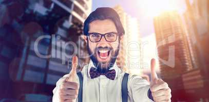 Composite image of portrait of cheerful man showing thumbs ups