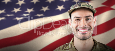 Composite image of close up of smiling soldier